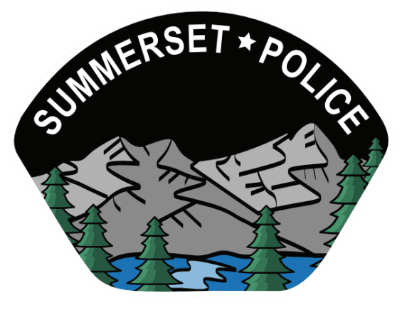 A patch of trees and mountains with the words " summerset police ".