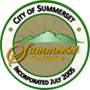 A green and white logo for the city of summerset.